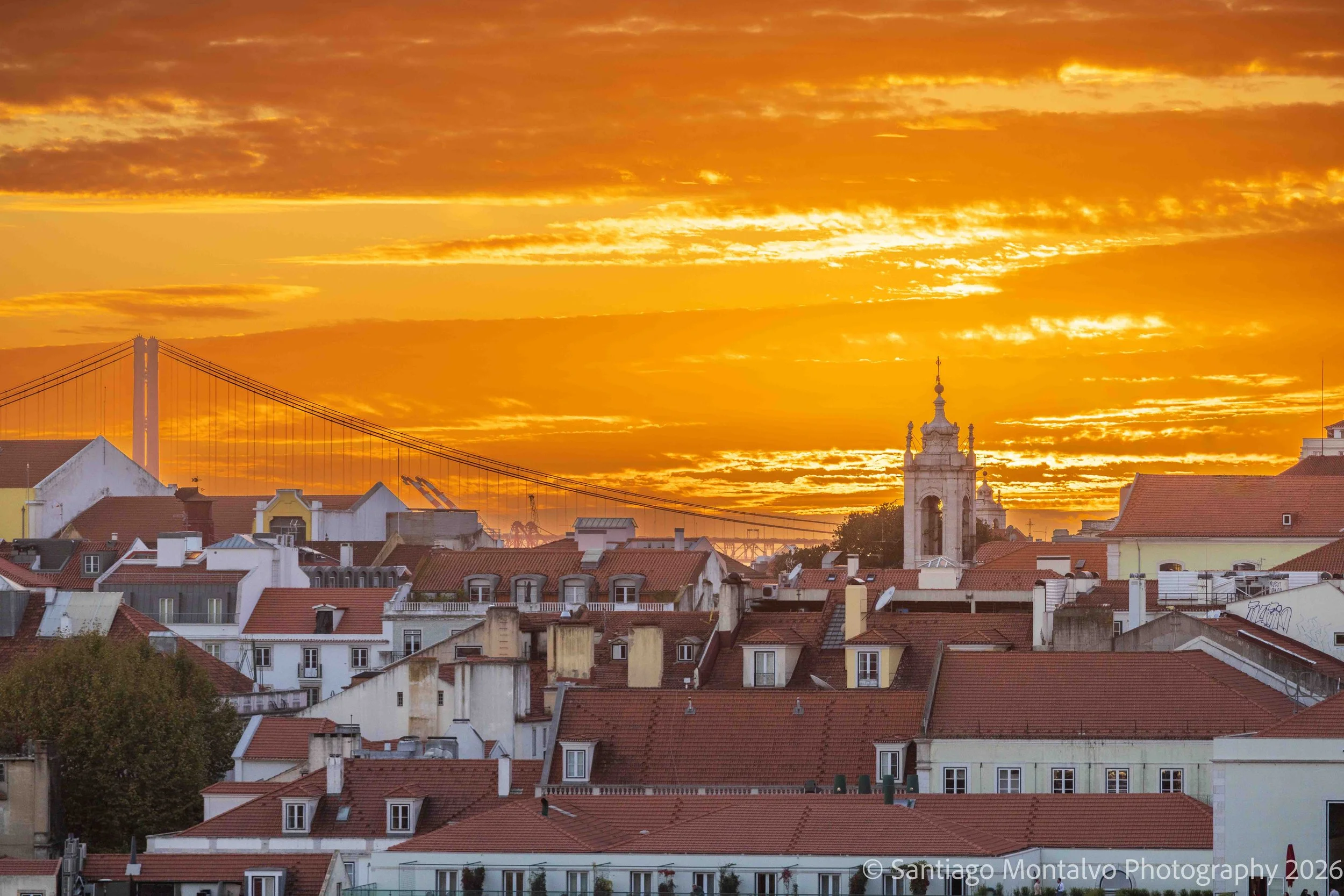 The Last Light — Lisbon, Portugal. Golden evening light settles over the city and its distant waters.