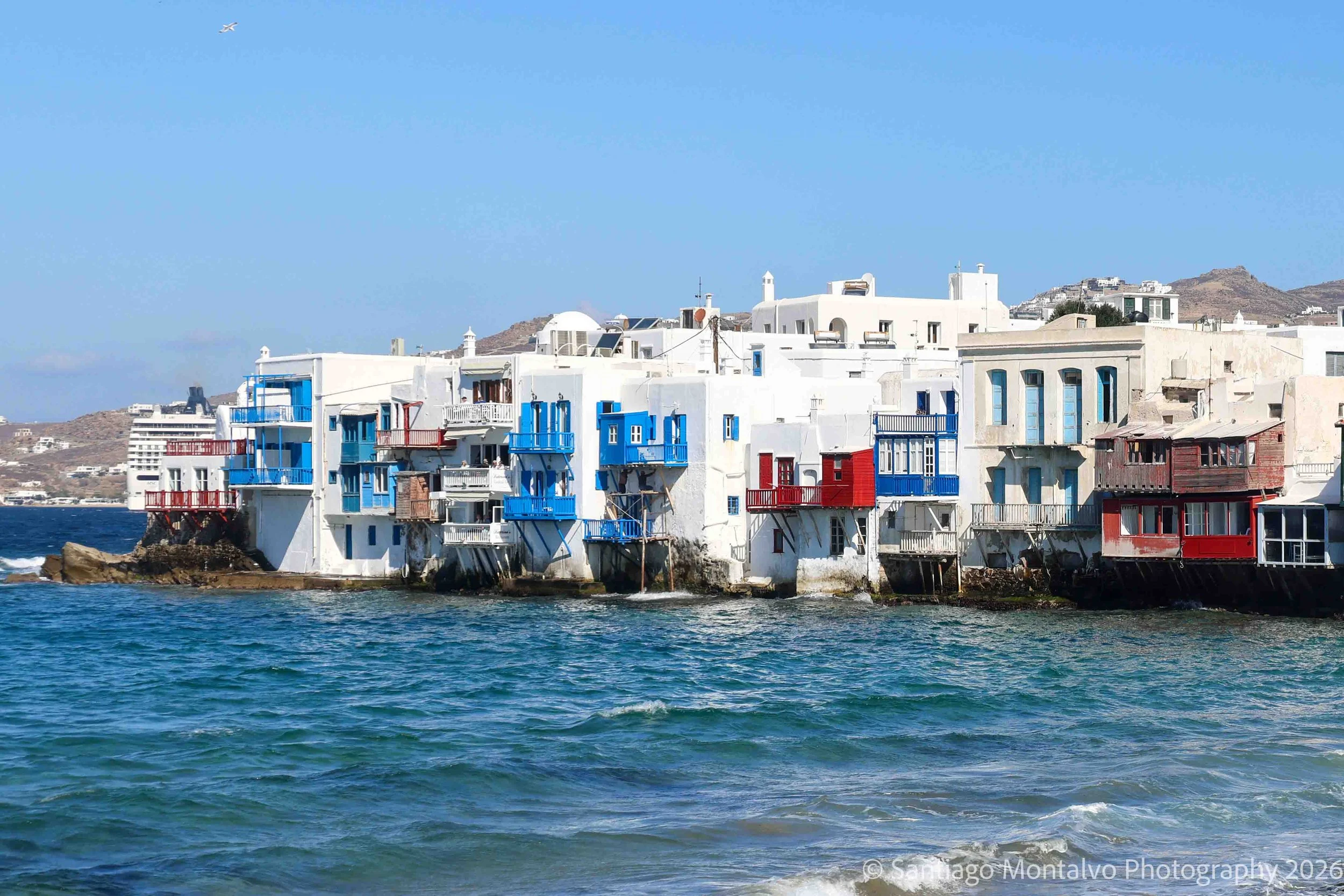 Little Venice — Mykonos, Greece. Colorful balconies and traditional white buildings meet the brilliant waters of the Aegean.