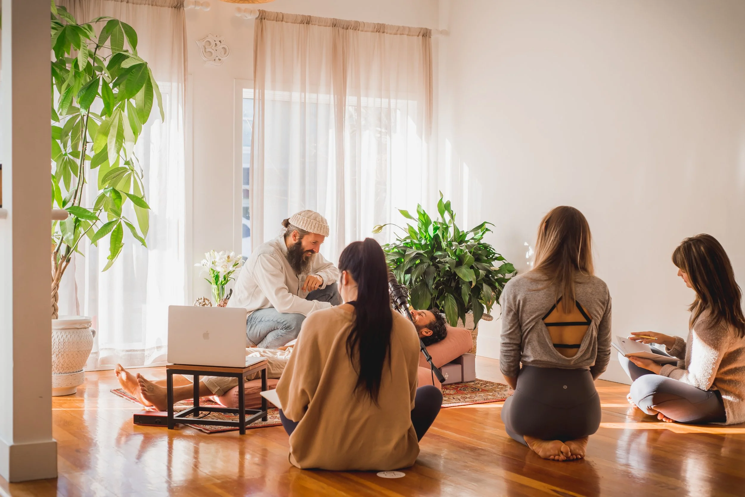 Students gathered for a 100 hour Pranayama Breathwork Teacher Training lecture, fostering a community of inclusive learning and Vedic study for teacher certification.