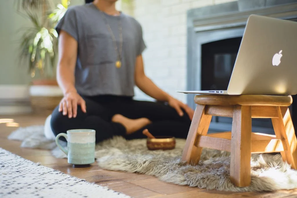 A student practicing Pranayama breathwork and Meditation during an online Pranayama Breathwork teacher training session with Muni Engel.