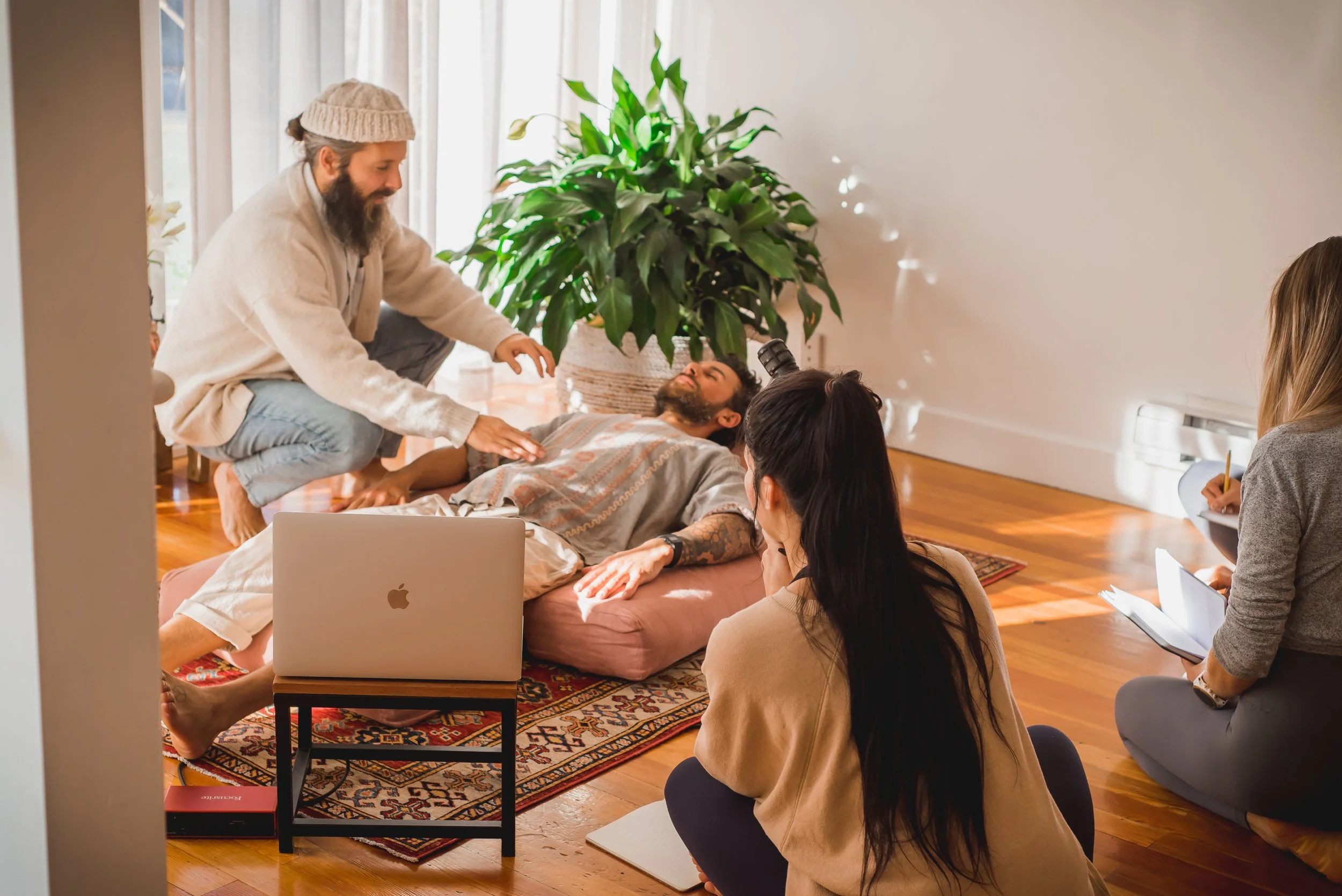 Muni Engel demonstrating therapeutic Pranayama breathwork techniques and respiratory assessment during a hands-on 100 hour Pranayama Breathwork teacher Training module.