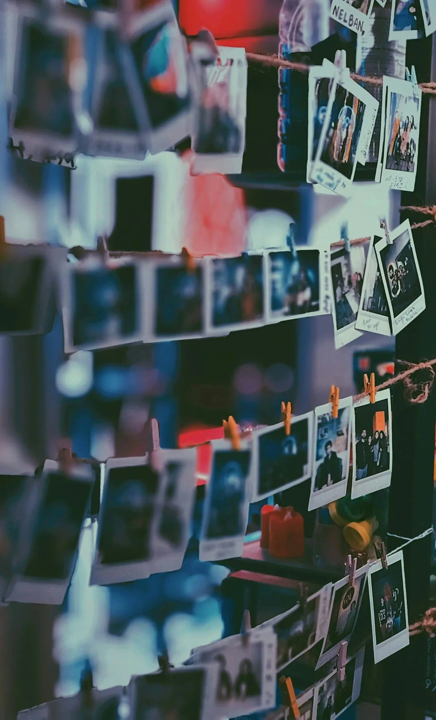 Photos attached to wall, depicting the Frame 1A's Slap it Up pop up community exhibition.