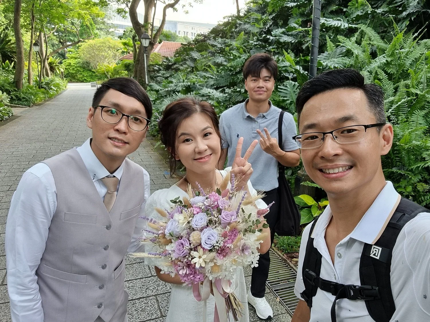 Wedding photographer taking photograph of wedding couple together in Singapore