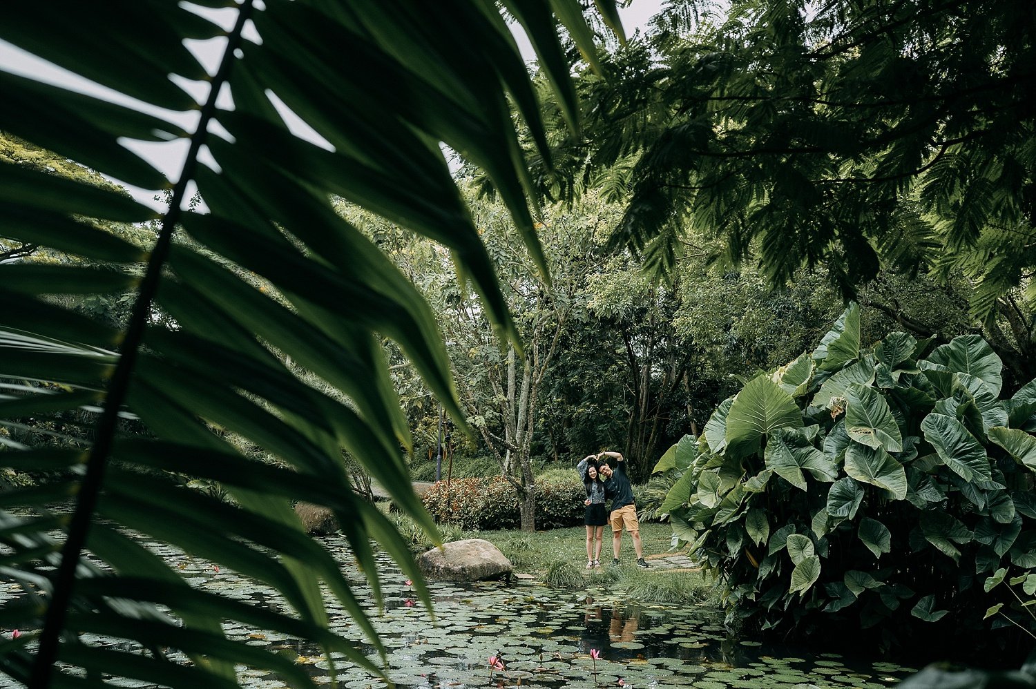 The couple was doing a heart shape sign after sucessfully proposal at Gardens by the Bay Singapore