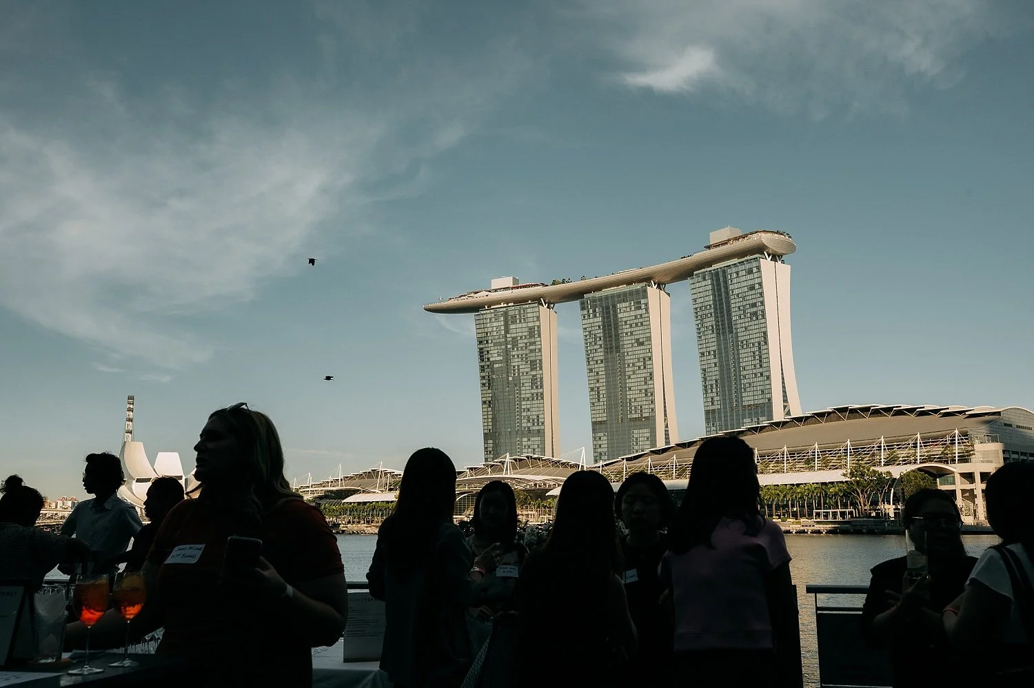 The stylish interior of Caffe Fernet during a professional networking event overlooking Marina Bay Sand