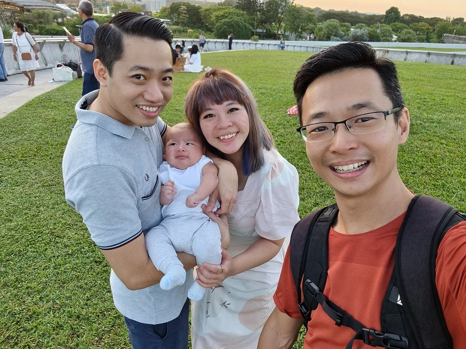Family photographer taking a selfi photo with his client after a family shoot in Singapore