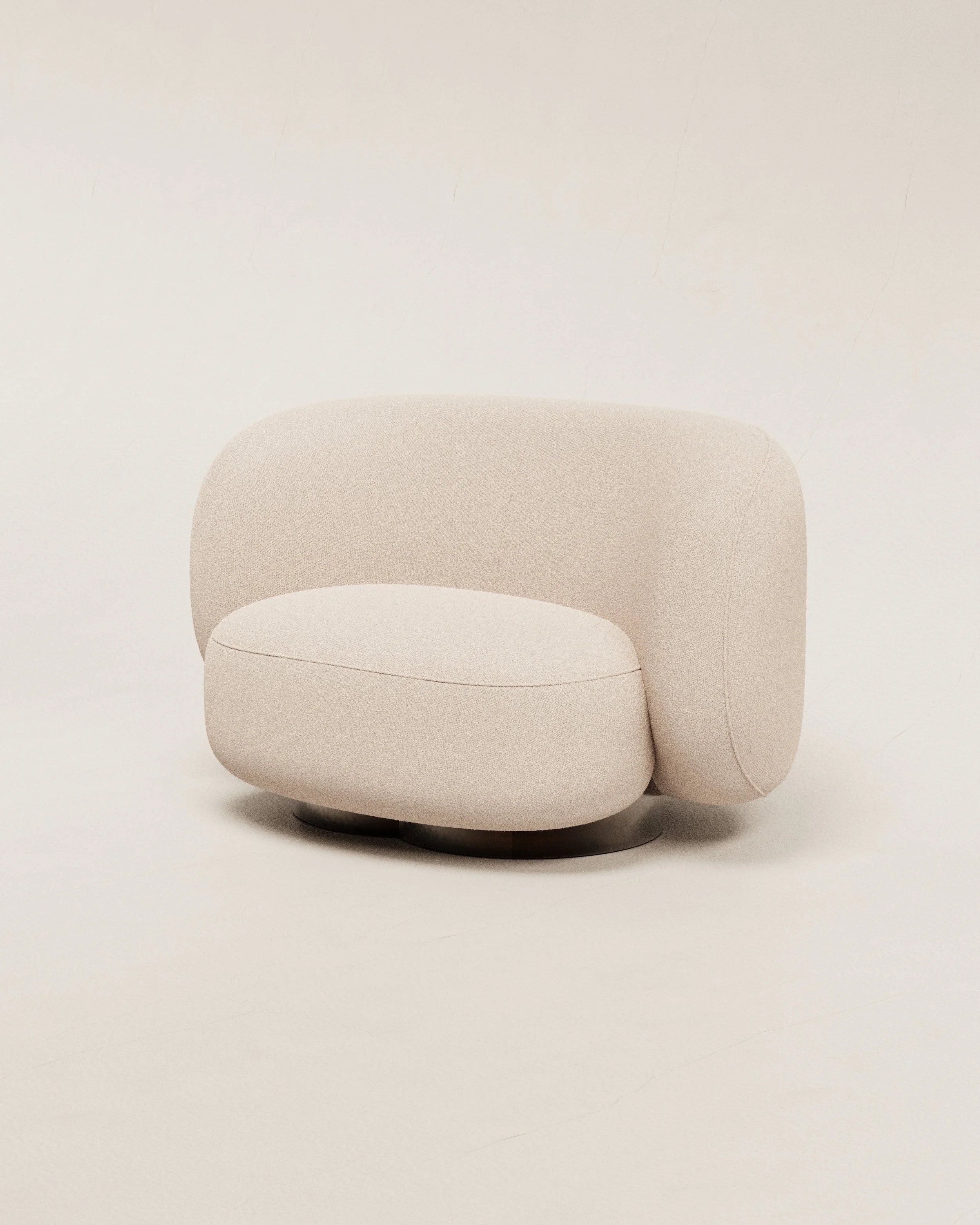 Modern beige upholstered armchair with rounded back and seat, set against a plain white background.