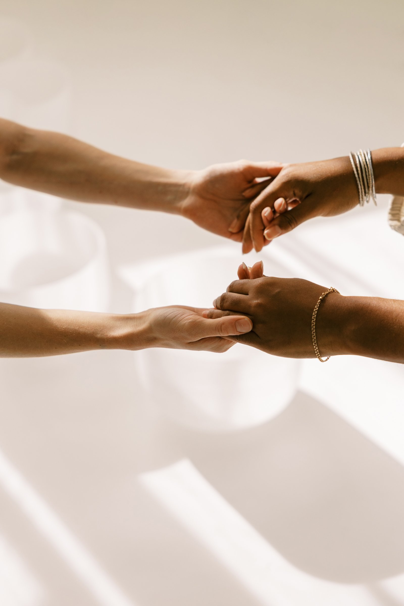 two women holding hands