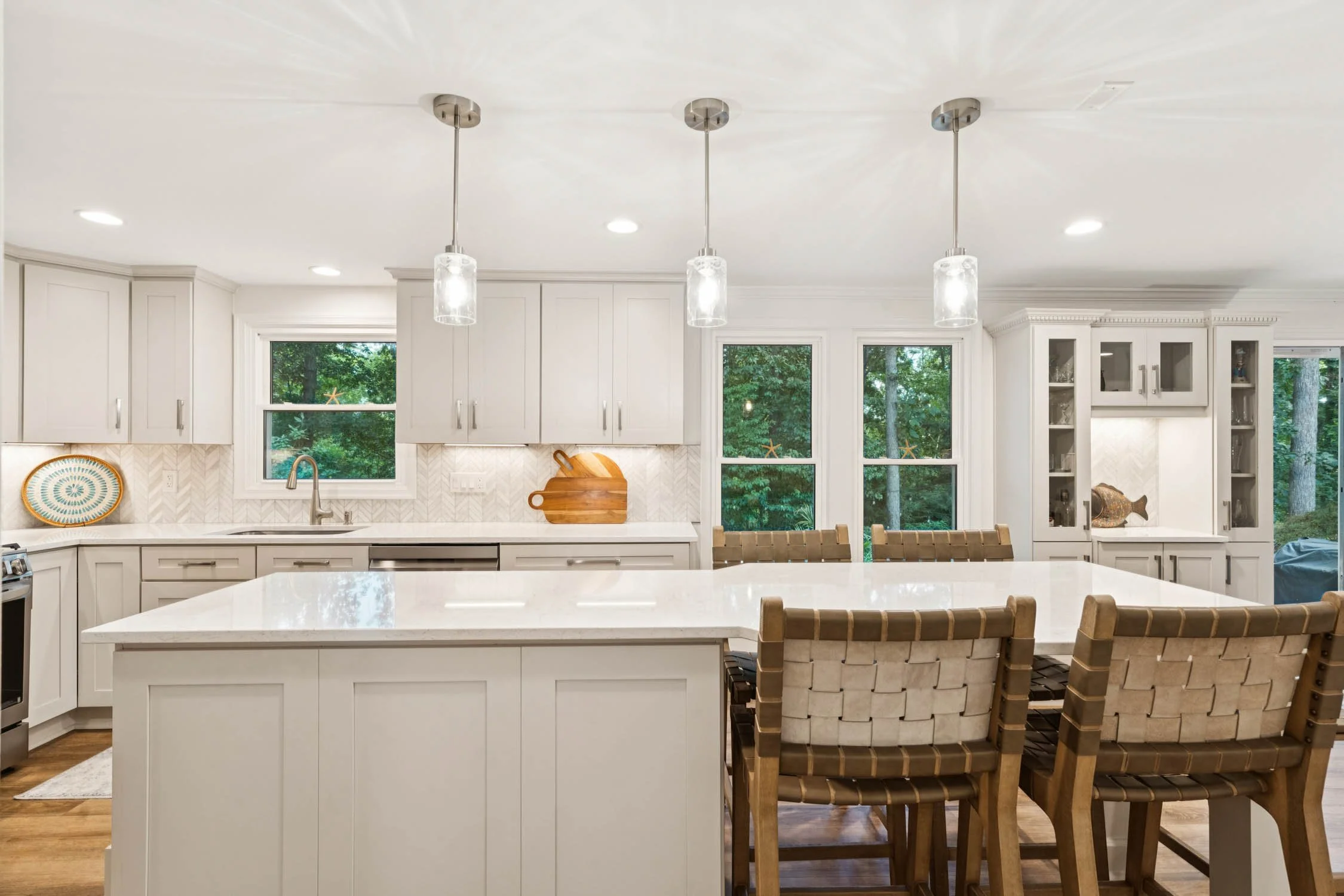 Luxury kitchen with stone countertop island and pendant lighting in a Northern Virginia home featured by LeAnne Anies for home valuation services