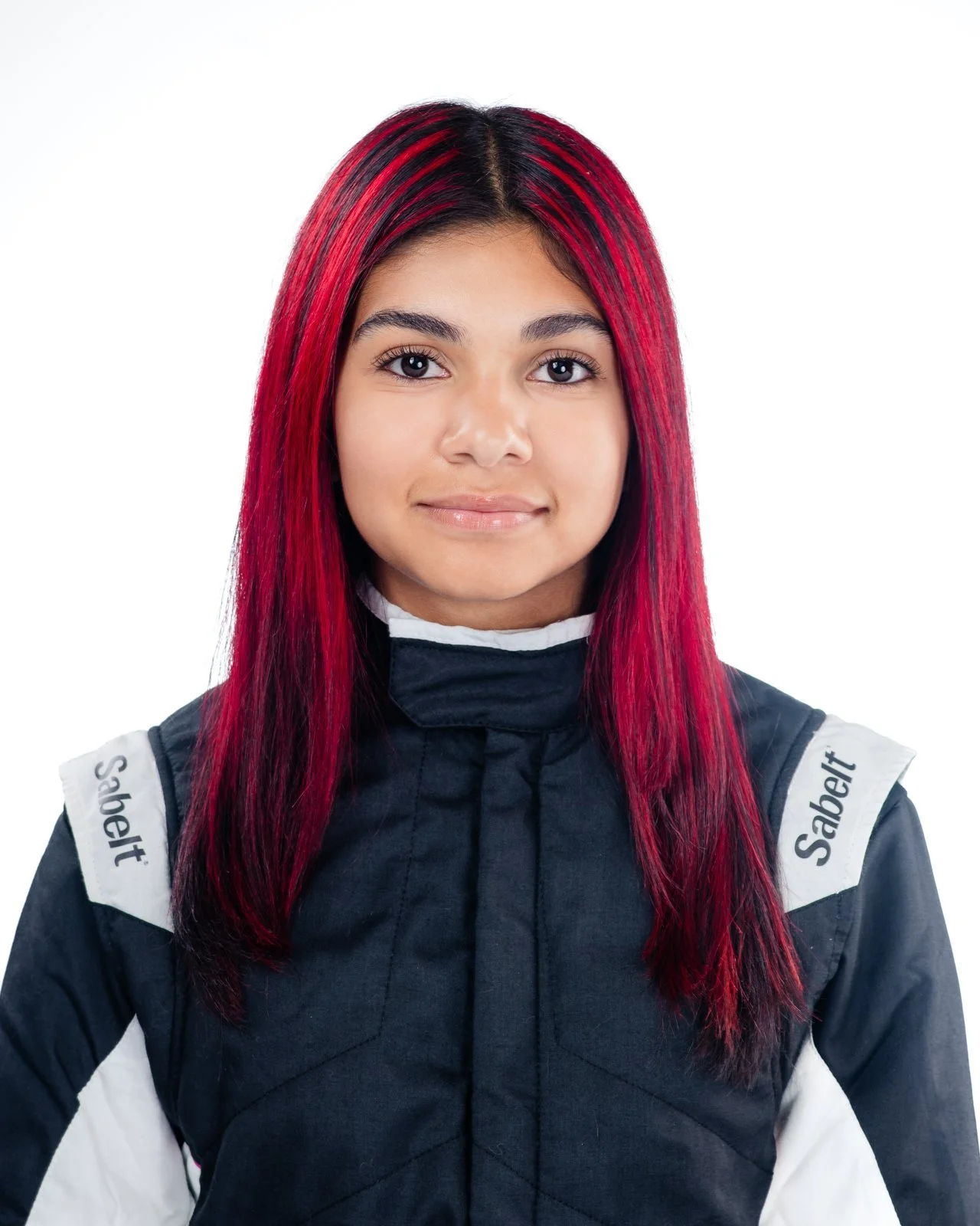 Studio headshot of Ana Palestro in her black and white Sabelt racing suit.