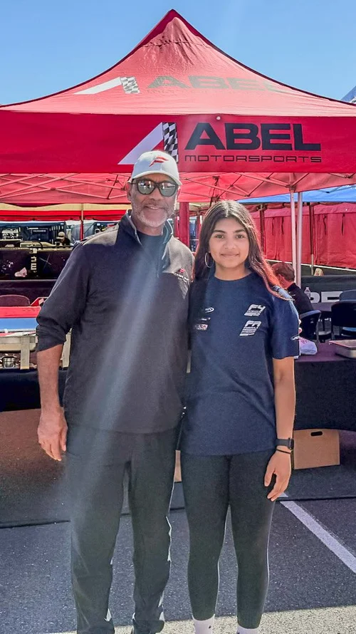 Ana Palestro with a supporter in front of the Abel Motorsports tent