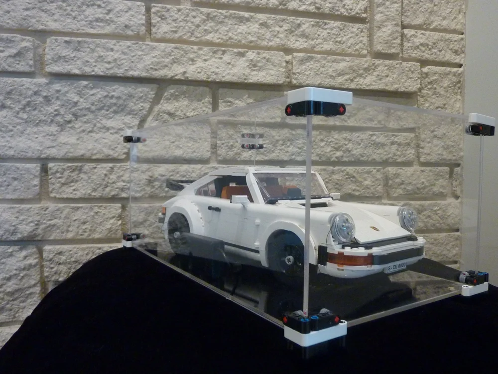 Ana Palestro's white LEGO Porsche 911 model in a clear display case