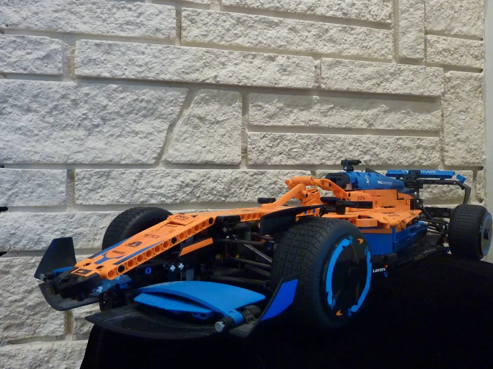 Ana Palestro's LEGO Technic McLaren Formula 1 race car model in orange and blue