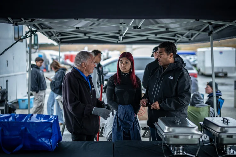 Ana Palestro with supporters under the team tent at Laguna Seca, June 2026