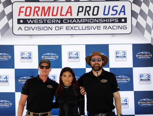 Ana Palestro with two supporters at the Formula Pro USA Western Championships backdrop