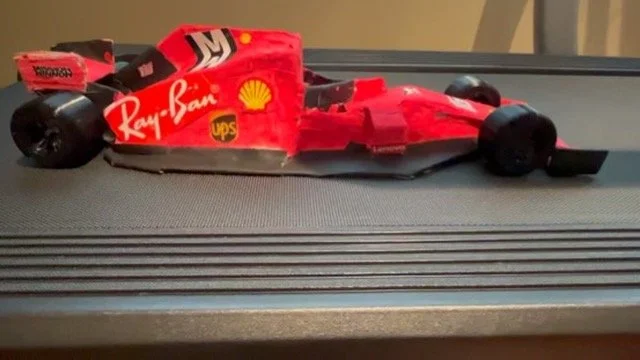 Ana Palestro's hand-built, to-scale red Ferrari Formula 1 car model, made for her 6th grade math class in June 2022