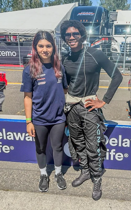 Ana Palestro with a fellow racing driver at the track