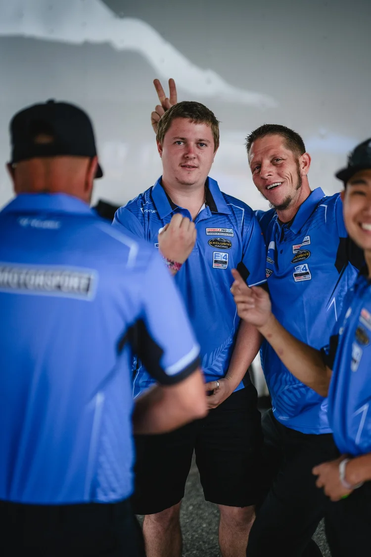 Ana Palestro's Kiwi Motorsport crew celebrating at Laguna Seca, June 2026