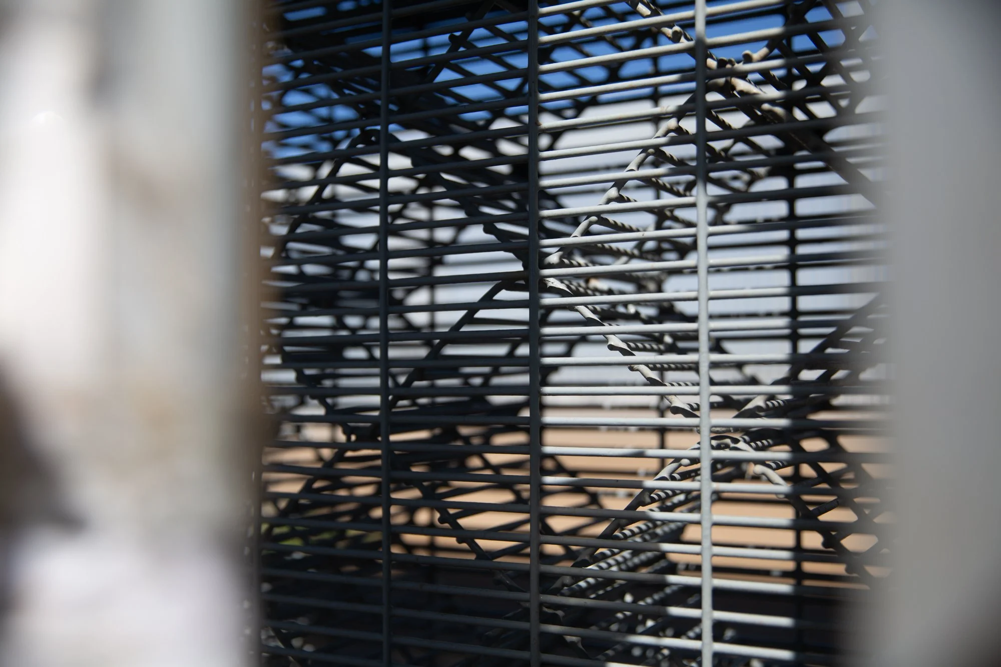 Metal mesh installed on the Mexican side of the border wall in Friendship Park in 2011 limits physical contact. Photo by Viyada Soukthavone.