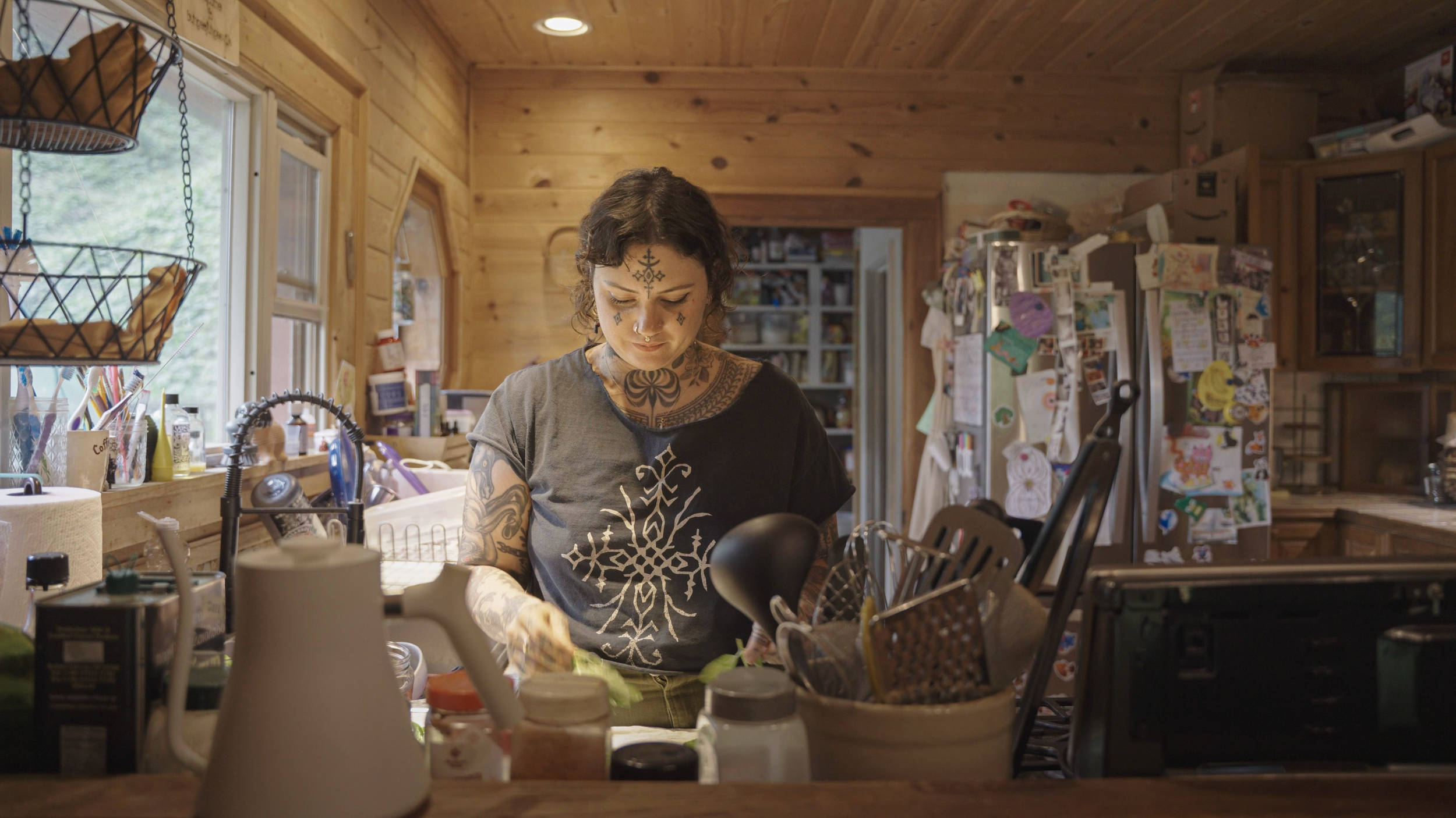 Baylen Levore prepares mint iced tea at her home in the French Broad River Valley, N.C., on May 13, 2025. The mint was harvested from the woods outside her home with her daughter.