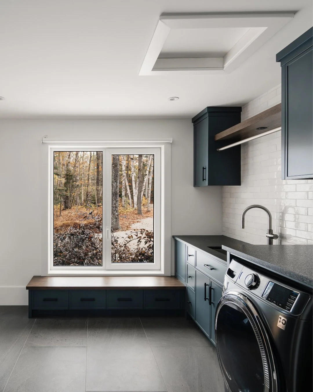 A hardworking space with an incredible view - welcome to the Island Point Cottage laundry room. ⁠
⁠
Swipe to see the before. ⁠
⁠
Contractor: @bredinbrothers⁠
Project Manager: Josh Otermanns⁠
Site Supervisor: Chad Scarrow⁠
Millwork: @heffnercw⁠
Photog
