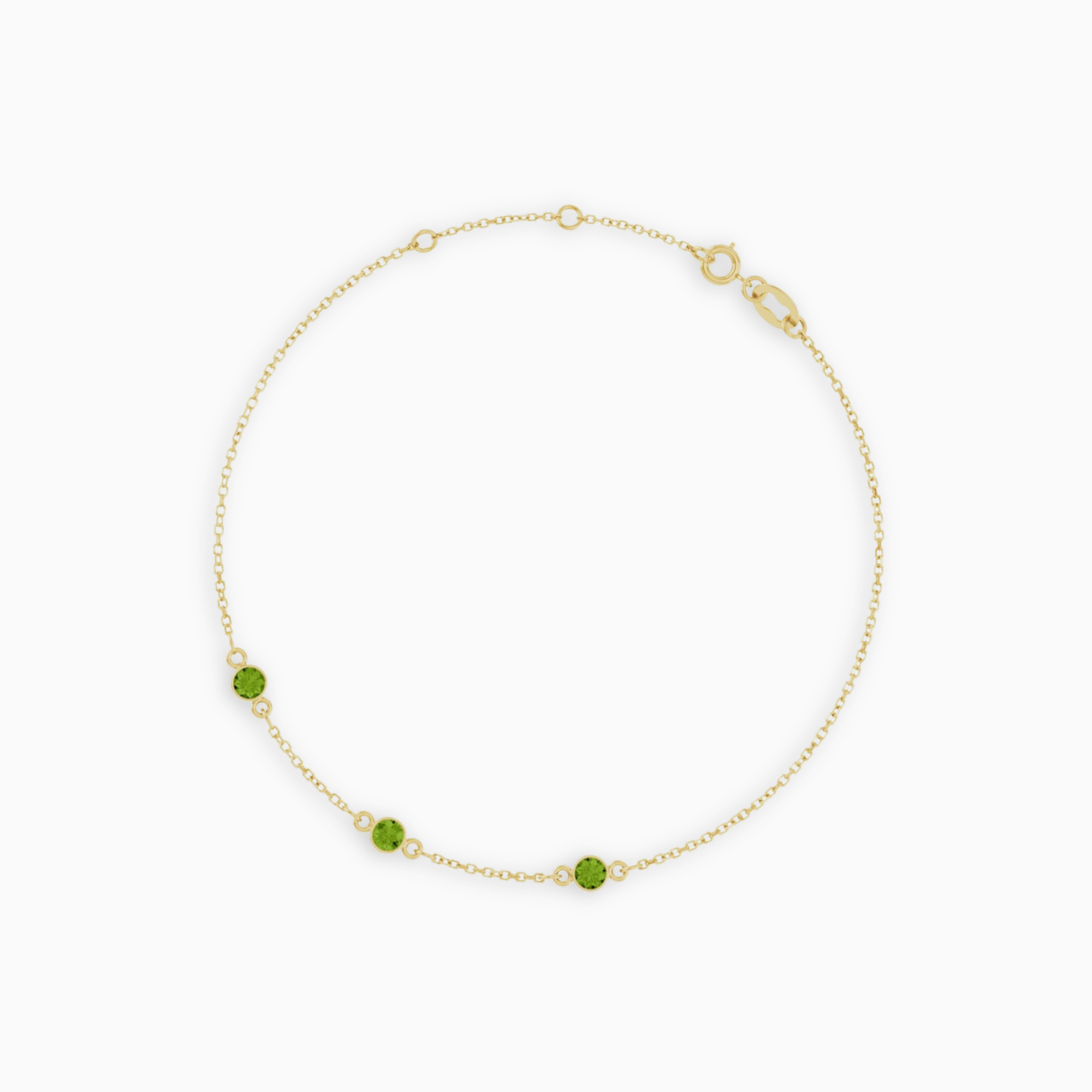 14K yellow gold bracelet with three bezel-set natural peridot gemstones
