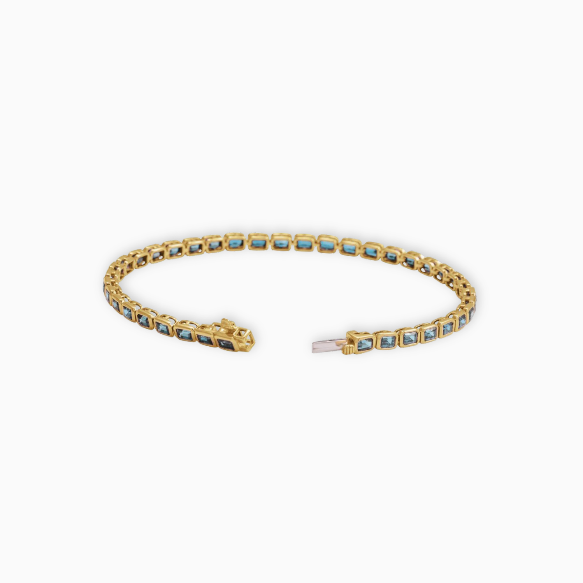 Sky blue topaz tennis bracelet in 14K yellow gold shown open with secure box clasp and bezel set gemstones