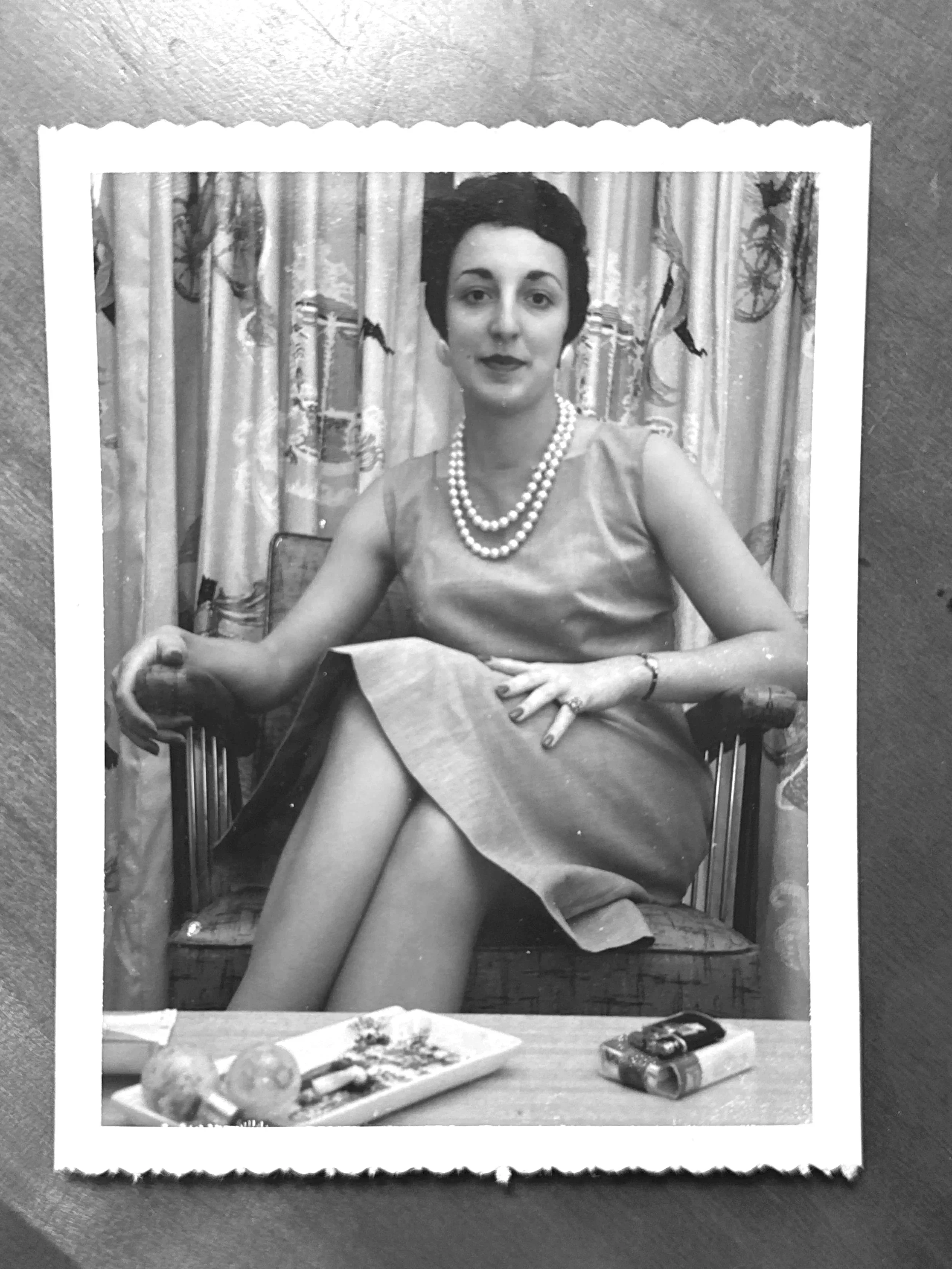 Vintage portrait of woman wearing fine jewelry, representing family heritage and legacy