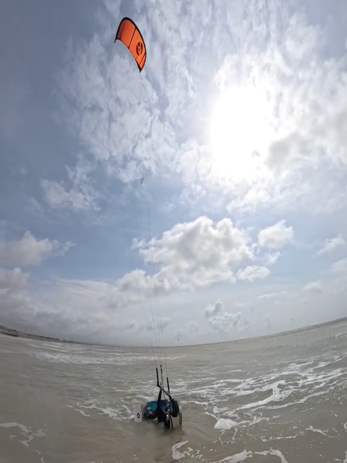 Kitesurfing student trying first water start on lancing beach West Sussex