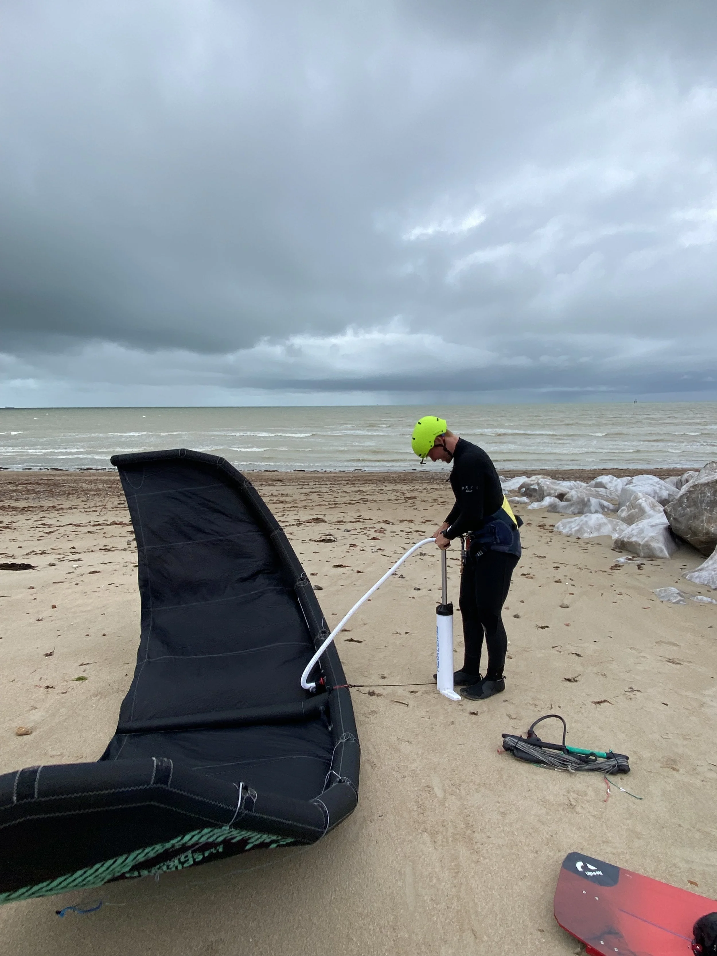 IKO instructor teaching kite setup on Lancing beach