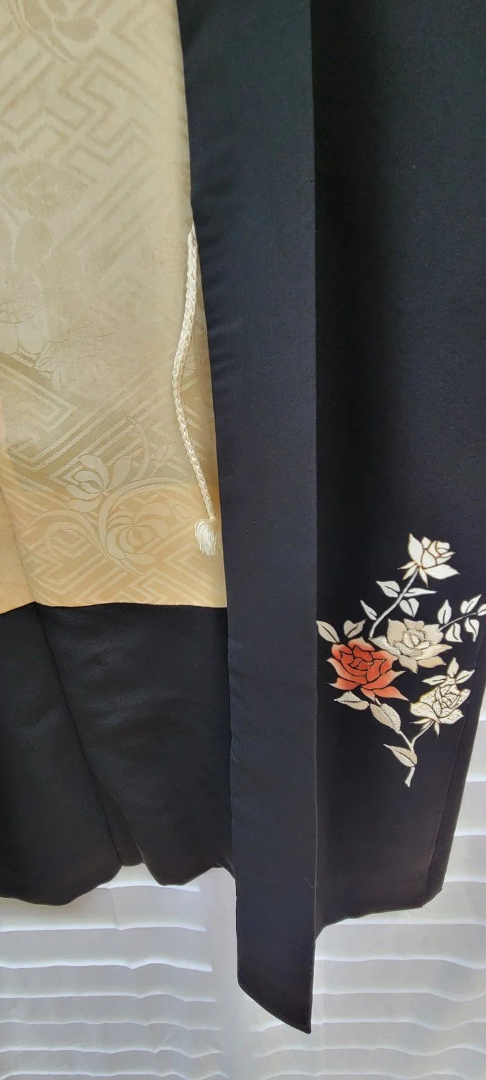 Floral rose detail and cream woven lining inside vintage Japanese haori