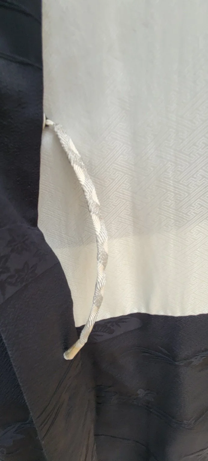 Ivory figured silk lining and pale braided haori himo inside vintage Japanese haori