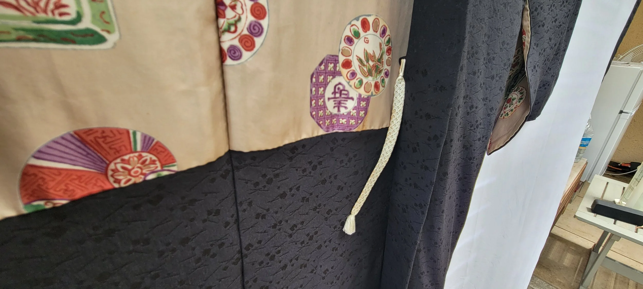Ivory silk lining with colorful seasonal medallions inside vintage Japanese haori