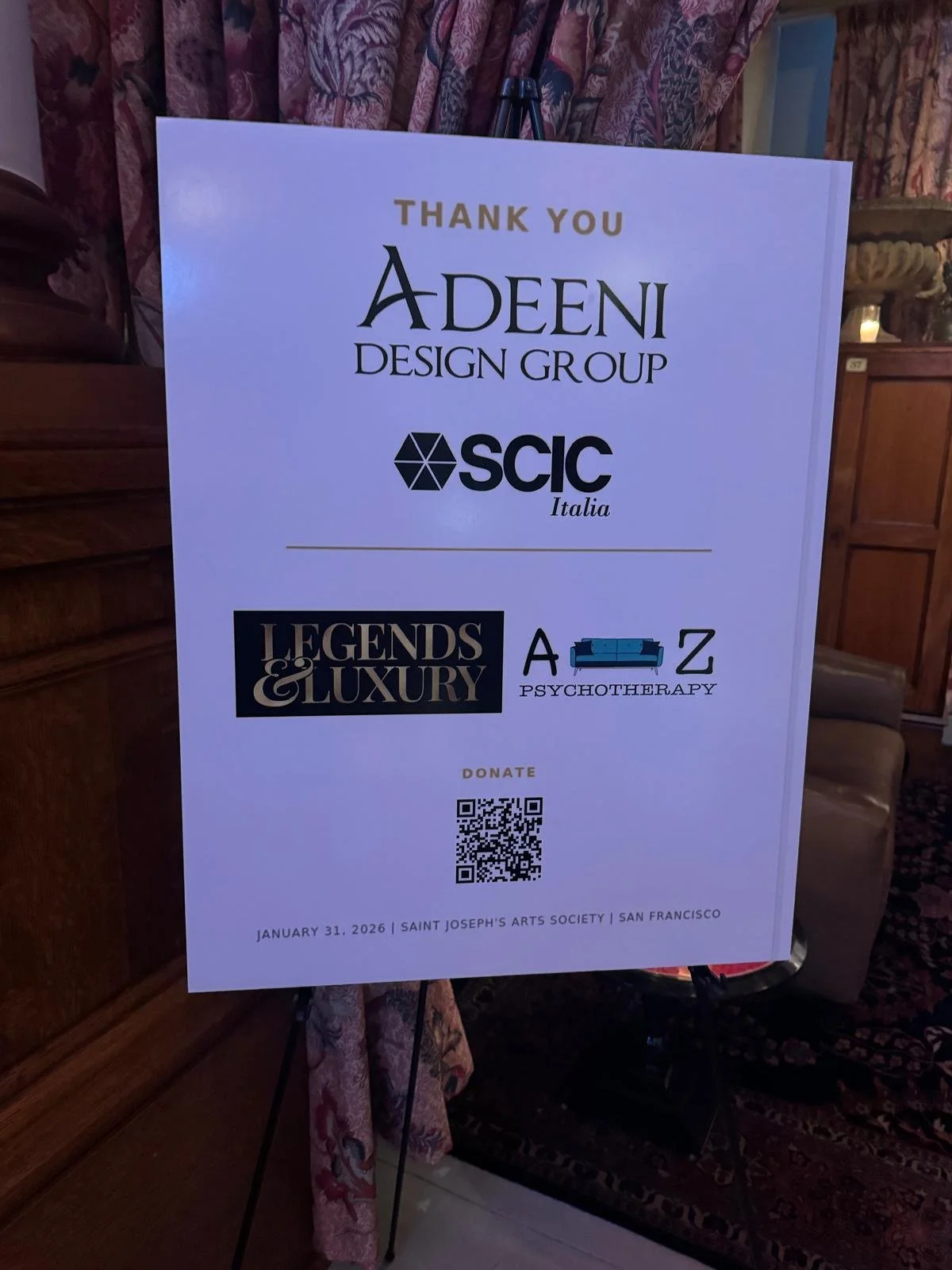 A thank you sign from Adeeni Design Group, SCIC Italia, and Legends & Luxury Psychotherapy at Saint Joseph's Arts Society in San Francisco, dated January 31, 2026, with a QR code for donations.