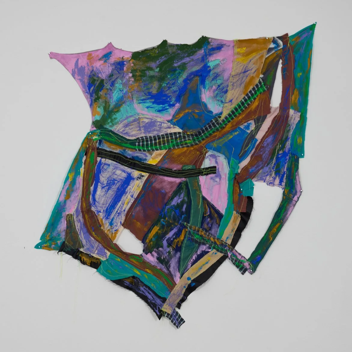 Assortment, 2024, acrylic on old pants, t-shirts, boxers, gifted skirt, jacket and part of a friend's cosplay machine-stitched together, 127 x 166. 