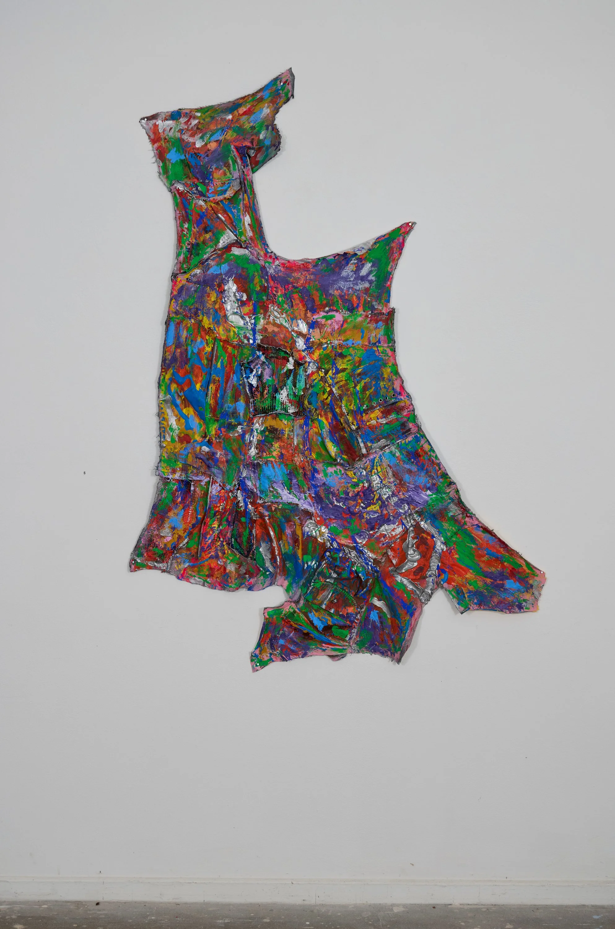 Colorful abstract sculpture on a white wall