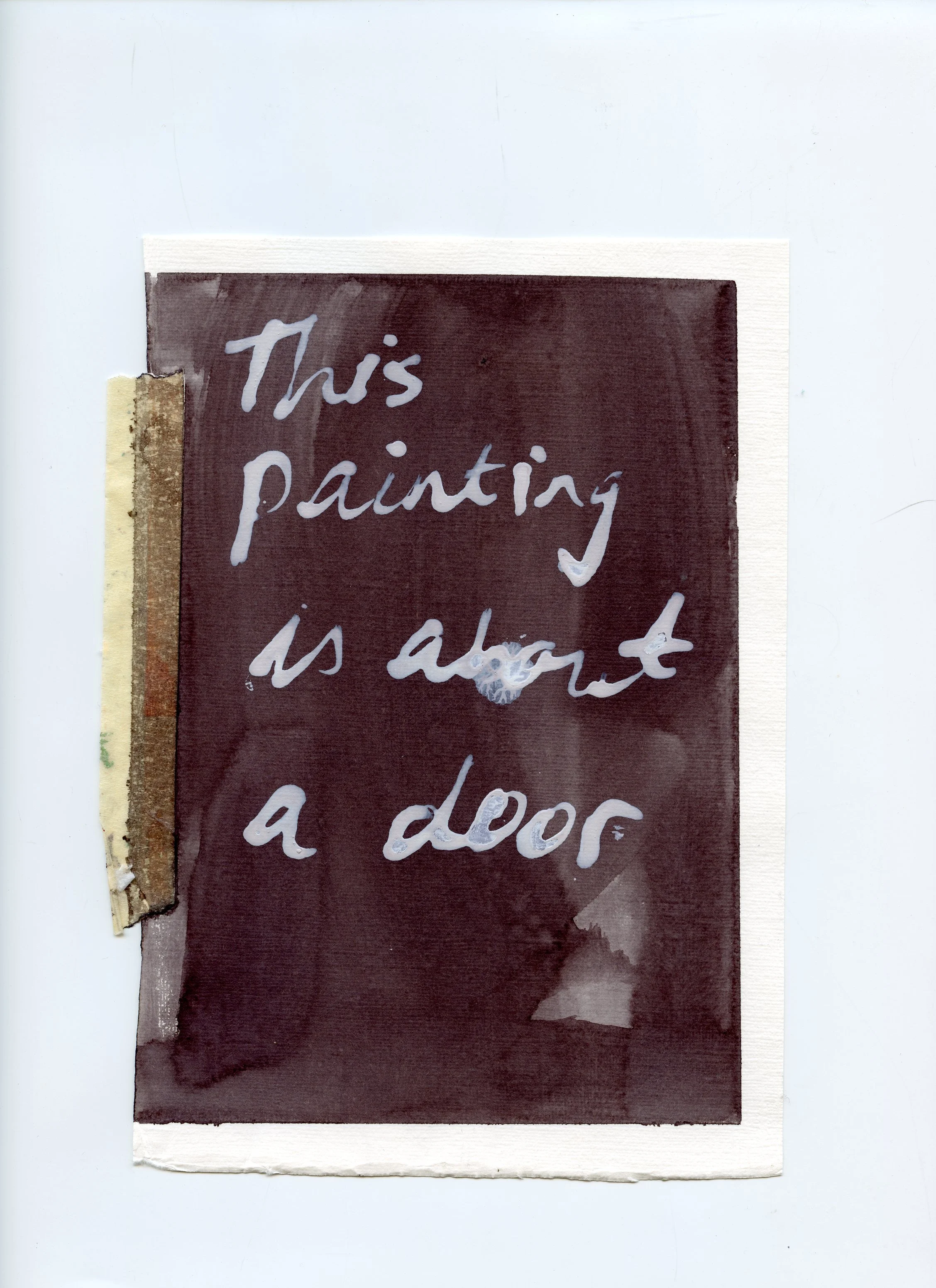 A handwritten note with the text "This painting is about a door" on a dark background, attached with a piece of tape.