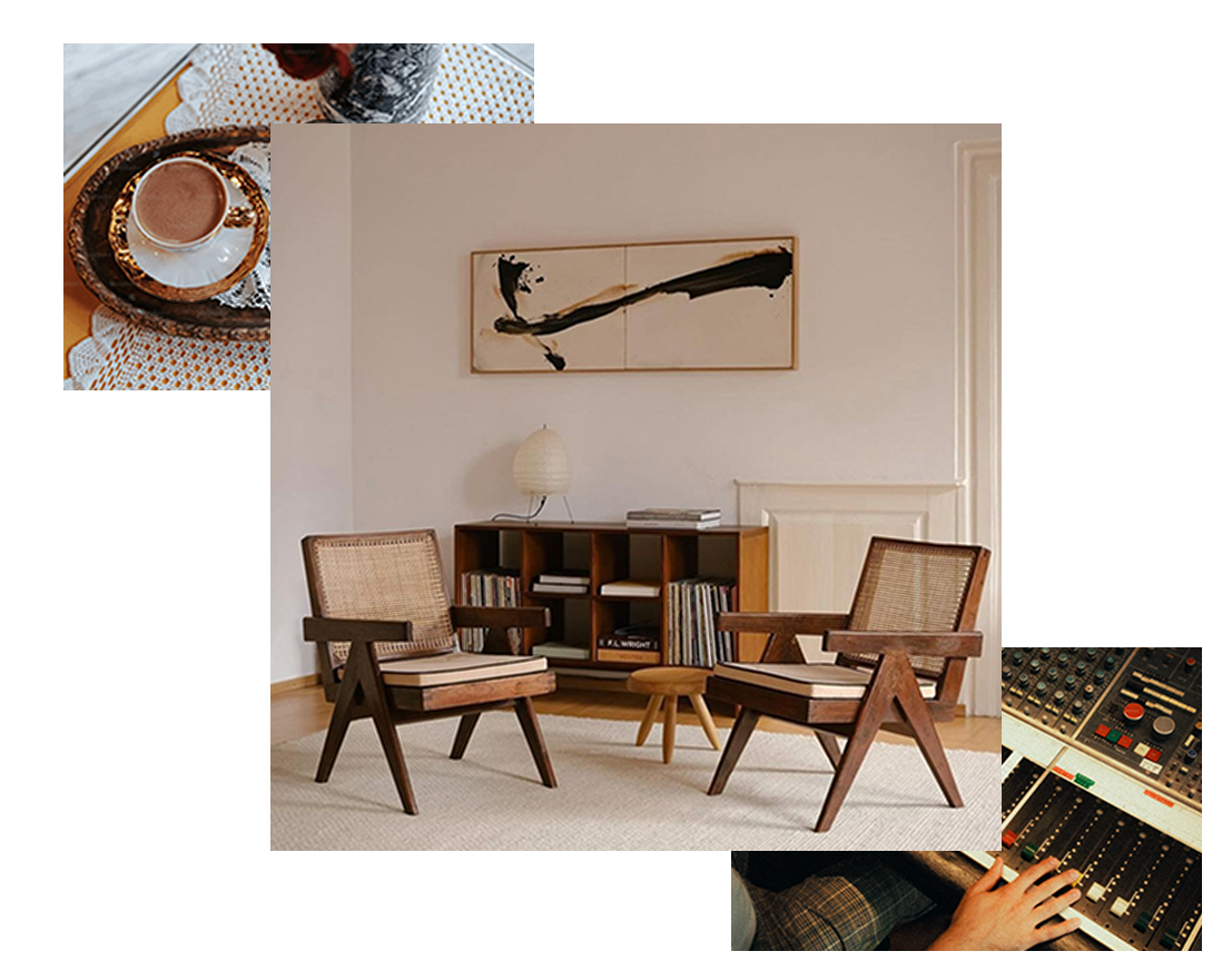 Living room with two wooden chairs, a small wooden stool, a bookshelf with books, a white lamp, and abstract artwork on the wall.