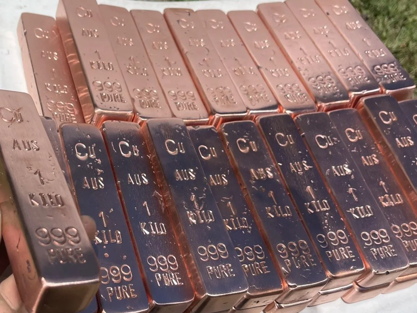 Stacked 1kg hand cast copper bullion bars 999 fine Hinterland Bullion Co