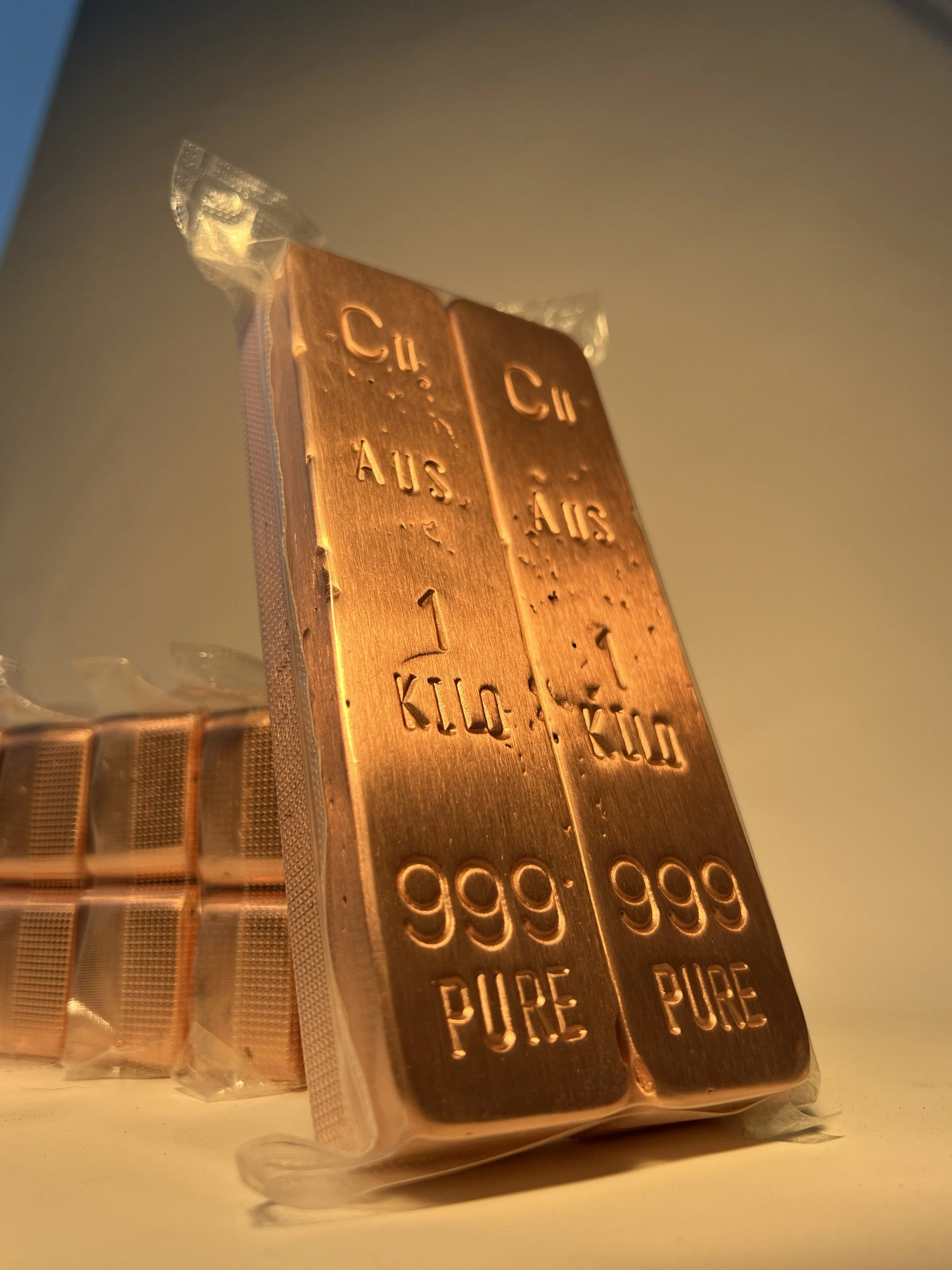 Close up of 1kg copper bullion bars sealed for delivery 999 fine Hinterland Bullion Co