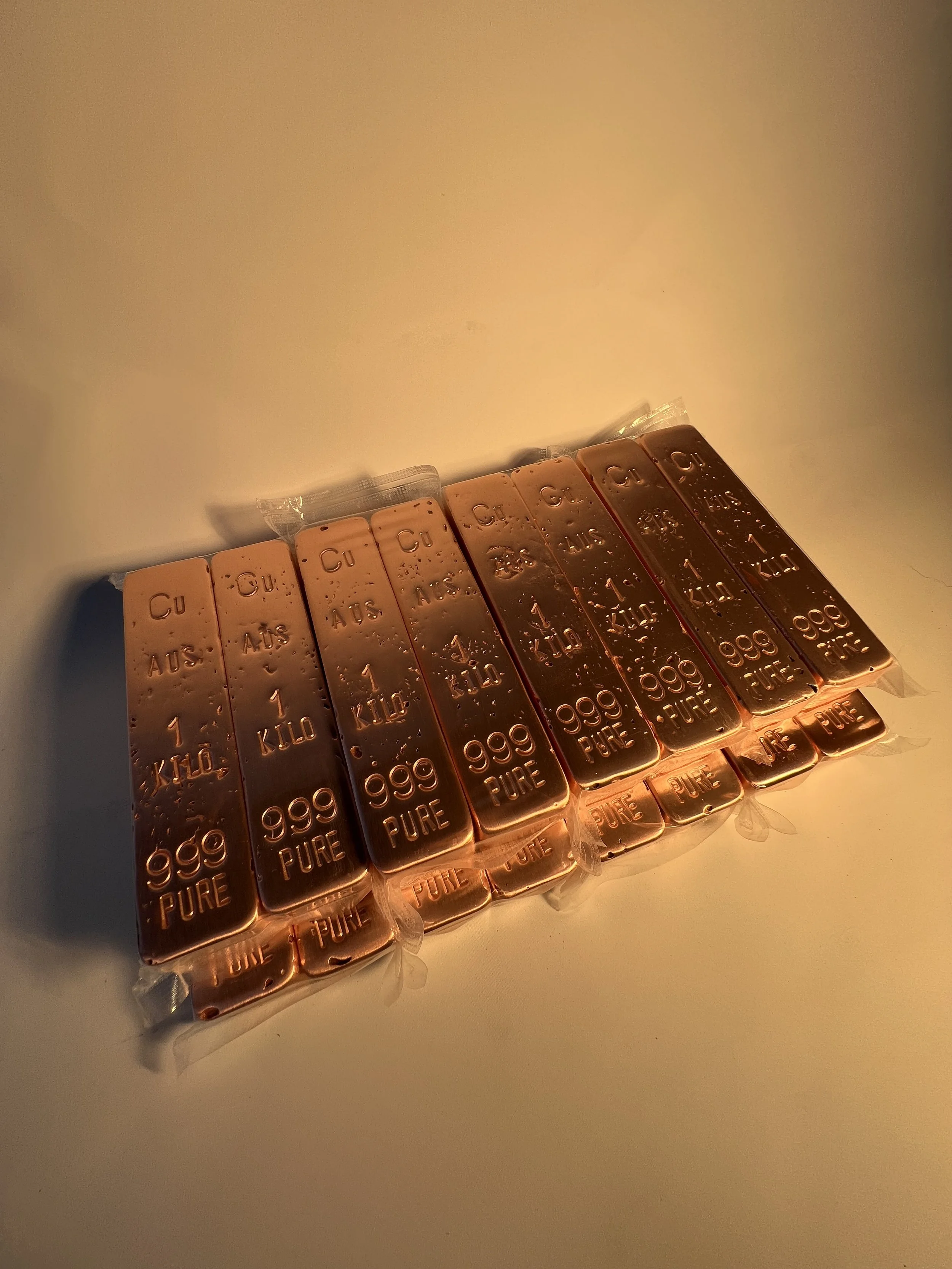 Raw stacked copper bullion bars 999 fine natural finish Australia