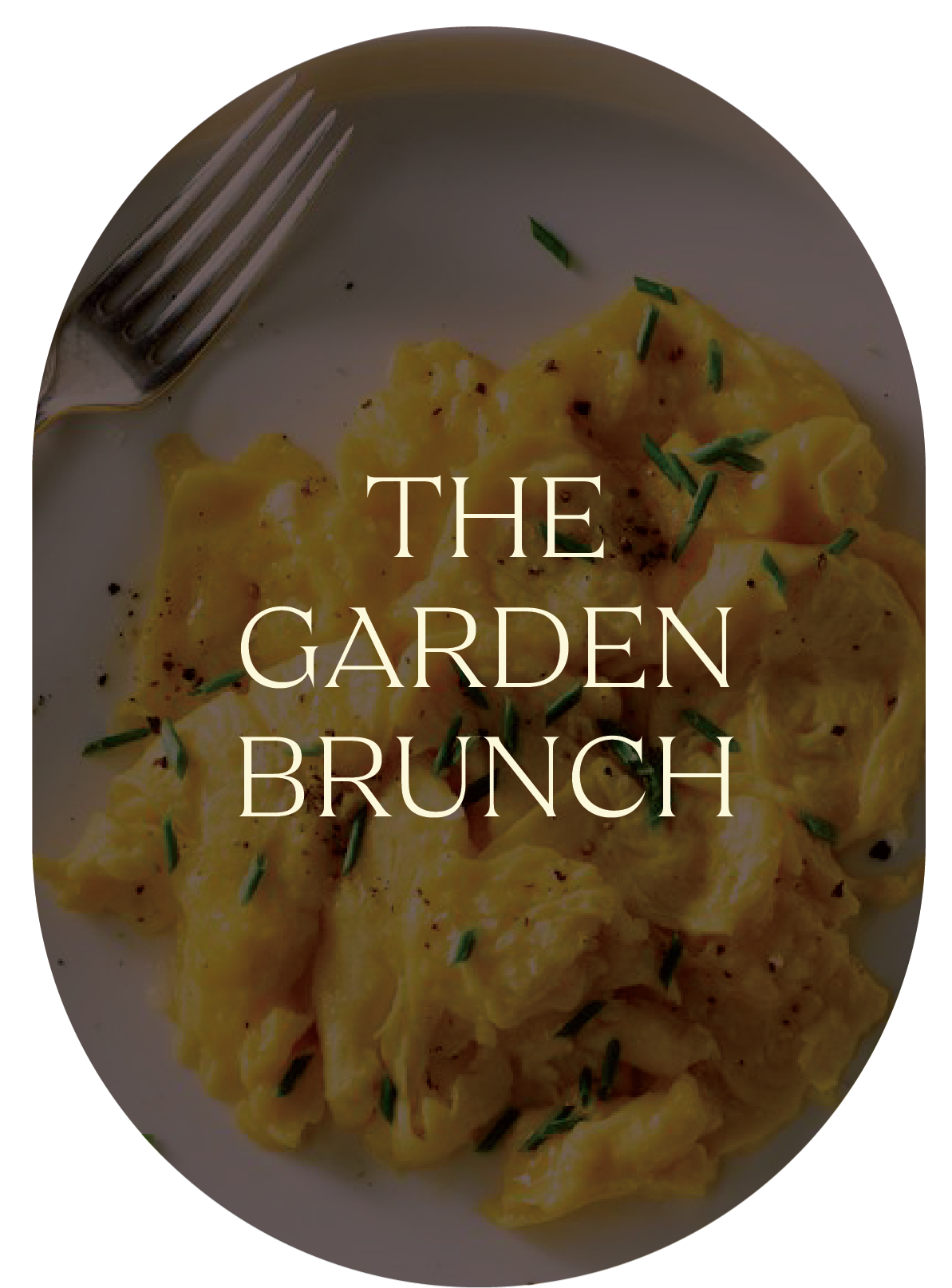 A plate of farm fresh scrambled eggs from North West Indiana garnished with garden herbs fresh from Pandemonium Gardens and a fork on the side, with overlaid text reading 'The Garden Brunch.'