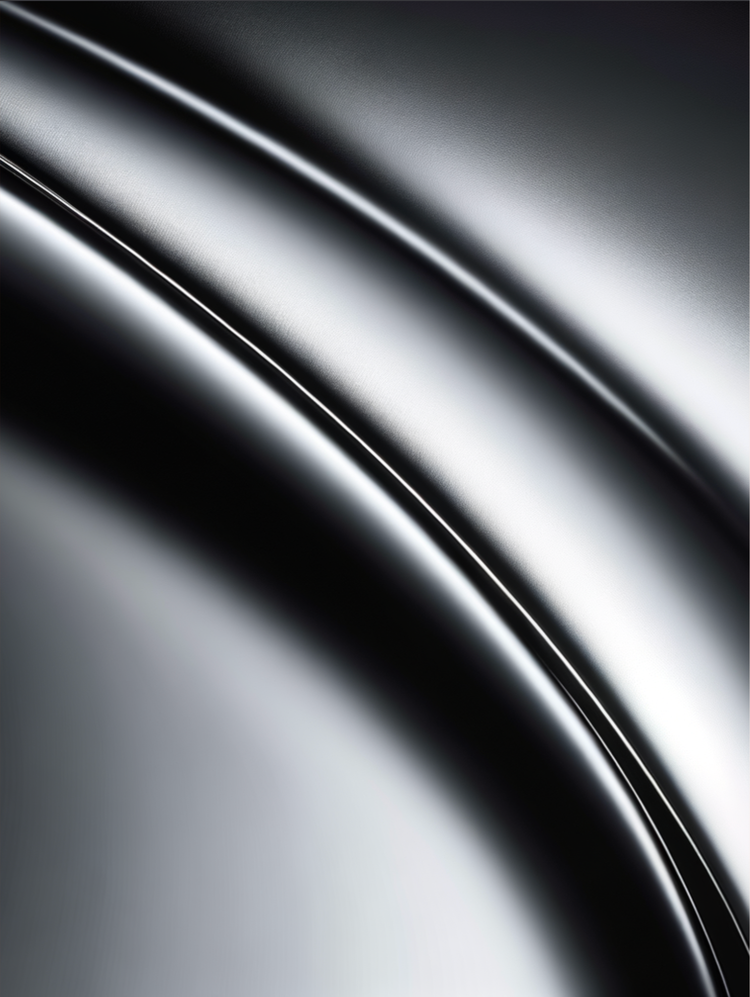 Close-up of a sleek, metallic, black surface with smooth curves and reflective highlights.