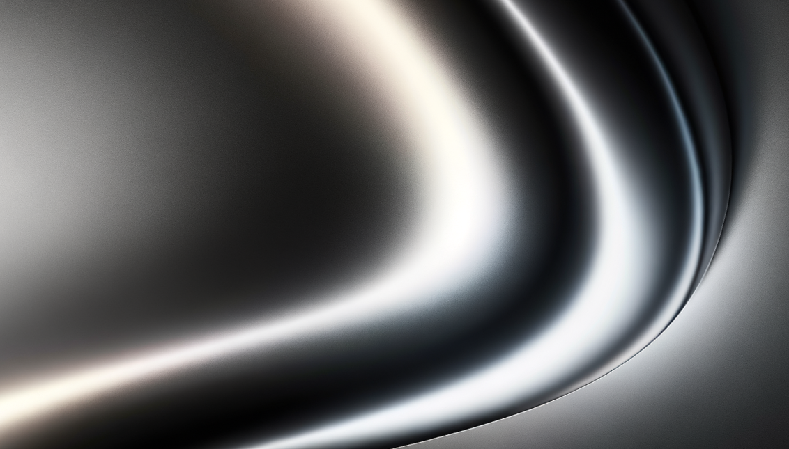 Close-up of a metallic, curved surface with smooth, reflective finish.