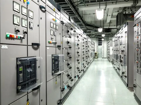 Row of electrical control panels and switchgear in a data center or control room
