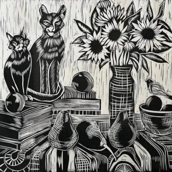Black and white drawing of two cats, a sunflower vase, a bird, and various fruits and books on a table.