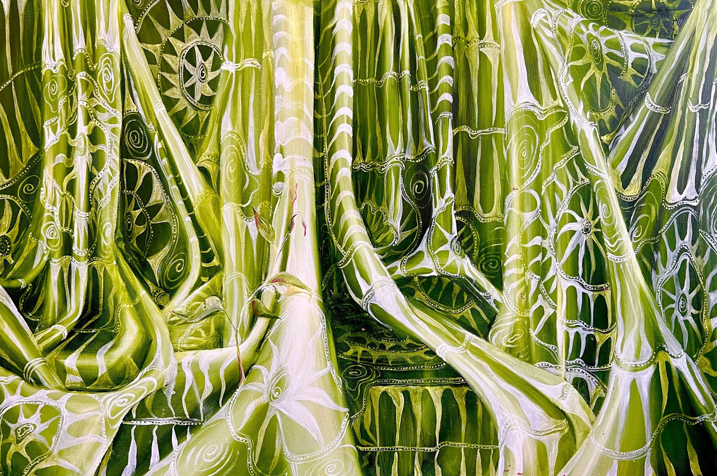 Close-up of a green cactus with white painted patterns and designs.