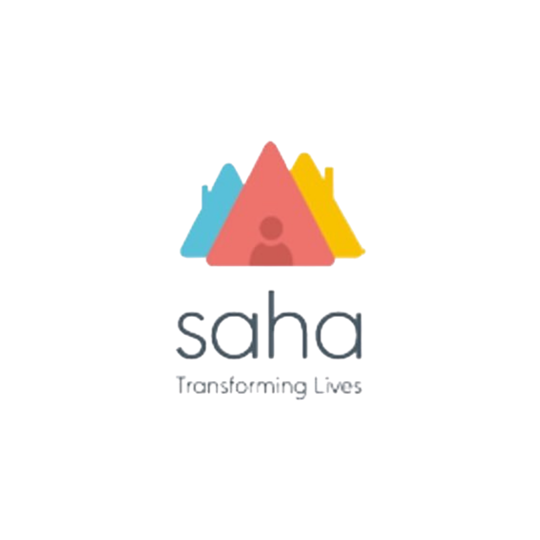 Saha Transforming Lives logo featuring three overlapping triangular shapes in coral, teal and yellow with a small human figure at the centre, above the organisation name and tagline in grey sans-serif type