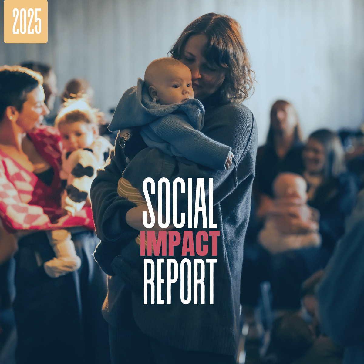 Cover image for the 2025 Social Impact Report showing a parent holding a baby while standing among families at a community event.
