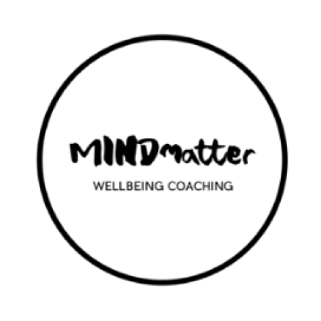 Mind Matter Wellbeing Coaching logo featuring the organisation name in mixed bold and handwritten black brush lettering within a simple black circle, with Wellbeing Coaching in small spaced capitals beneath